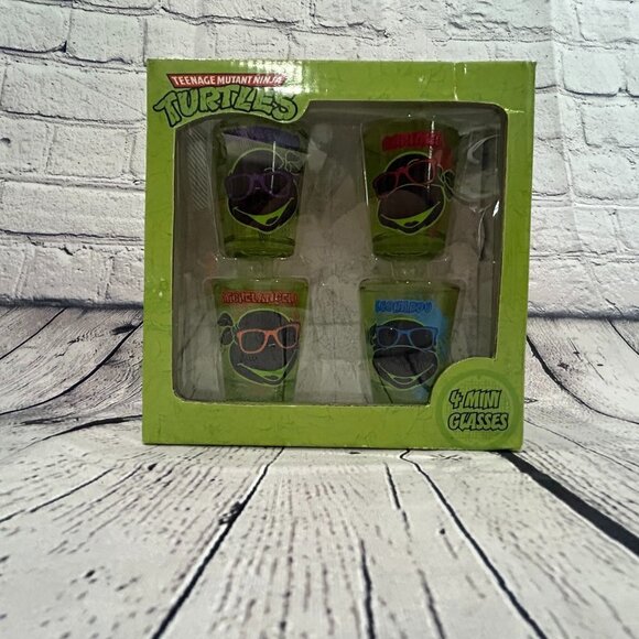 New in package Teenage Mutant Ninja Turtles Faces Shot Glass Set of 4 - Picture 1 of 2